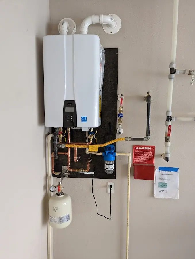 Professional plumber installing copper piping in a Lake Forest home